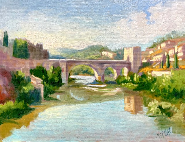 Pintura al óleo que representa un puente sobre un río en un paisaje natural, rodeado de vegetación y colinas. El cielo es azul con nubes suaves, y hay edificaciones a la orilla del río.